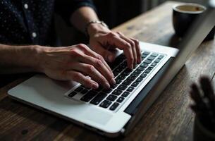Man Worker Work Laptop Desk Office remote work on notebook photo