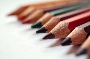 Pencils lie on white paper art tool for hobby of drawing photo