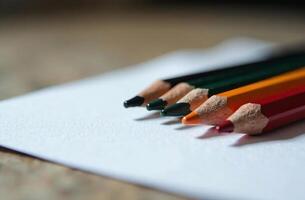 Pencils lie on white paper art tool cabinet hobby of drawing photo