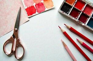 Watercolor paint on artist parlour desktop, art tool for hobby of drawing photo