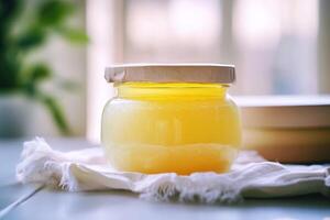 A jar of honey on a table photo