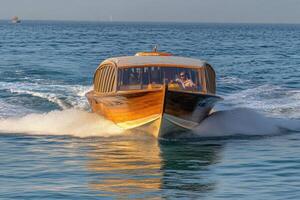 A boat with a wooden hull photo