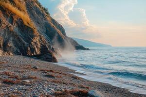 A rocky beach with waves and a cliff photo