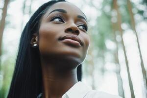 A woman with long hair looking up photo