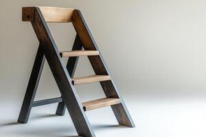 A wooden ladder with a wooden step photo