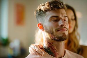 A man with a tattoo on his neck is looking at a woman photo