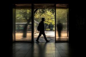A man walking through a doorway photo