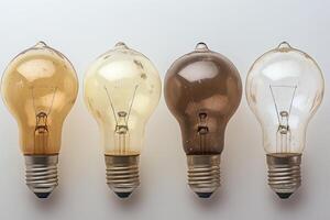 Four Worn-Out Incandescent Light Bulbs in a Row photo