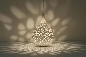 White Teardrop-Shaped Light Fixture With Intricate Cutouts Casting Geometric Shadows photo