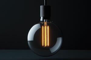 Illuminated Vintage Light Bulb with Filament and Black Socket photo