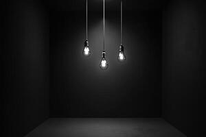 Three Light Bulbs Hanging in a Dark Room photo