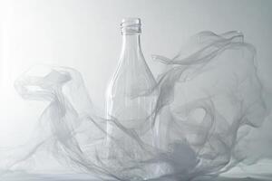 Glass Bottle Surrounded by Sheer White Fabric photo