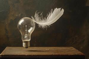 Light Bulb with a White Feather Floating Above a Wooden Surface photo
