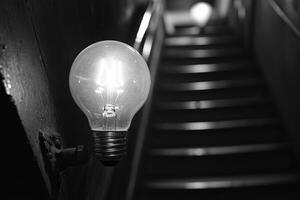 A Lightbulb Illuminating a Dark Stairway photo