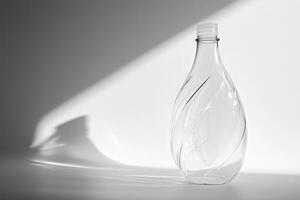 Transparent Twisted Plastic Bottle on White Background photo