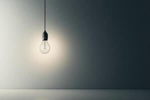 A Single Lightbulb Hanging From a Ceiling in a Dark Room photo