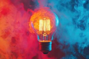 A Lightbulb Glowing in Red and Blue Smoke photo