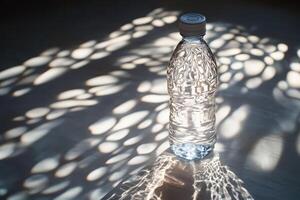 A Plastic Bottle of Water with Sunbeams Creating Light Patterns photo