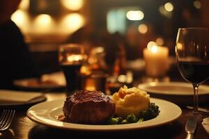 Gourmet Steak Dinner Served with Mashed Potatoes and Broccoli photo