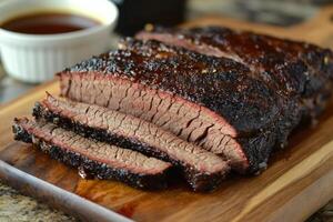 Sliced Smoked Brisket on Wooden Cutting Board photo