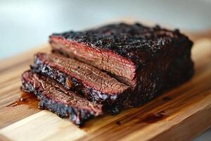 Sliced Smoked Brisket On Wooden Cutting Board photo