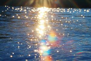 Sunlit Water Surface Glistening With Sparkling Light Reflections photo