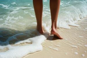 Legs and Foamy Waves on Sandy Beach photo