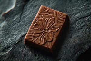 Dark Chocolate Piece With Floral Design photo