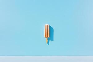 A single popsicle stands against a blue background photo