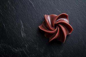 Dark Chocolate Swirl Candy On Black Slate photo