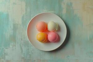 Four Colorful Scoops Of Ice Cream On A Plate photo
