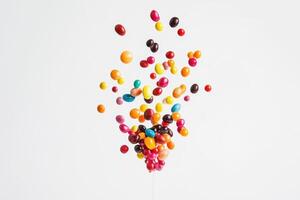 Colorful Candies Exploding Upward In Air photo