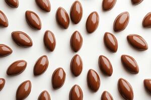 Delicious Chocolate Candies Arranged on White Background photo