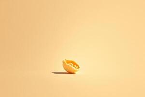 Peeled Orange Segment on Pale Yellow Background photo