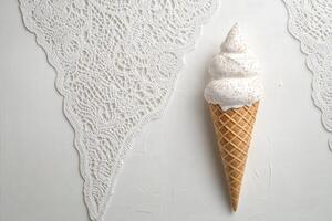 White Ice Cream Cone On White Lace Doily photo