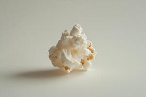 A Single Piece Of Fluffy Popcorn On White photo