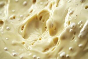 Creamy Yellow Substance With Bubbles Swirling photo