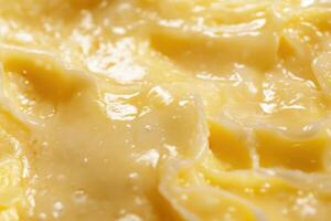 Creamy Yellow Substance Close Up Texture photo