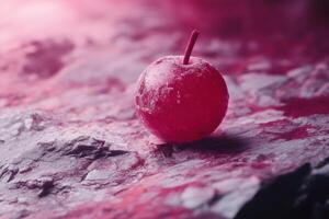 Frozen Red Cherry on a Textured Surface photo