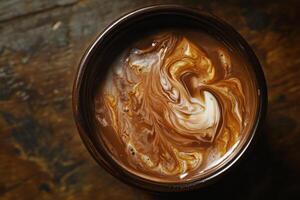 Swirled Cream in Dark Brown Hot Chocolate Drink photo