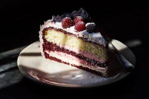 Delicious layered cake with raspberries and frosting photo