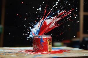 Red white and blue paint explodes from a can photo