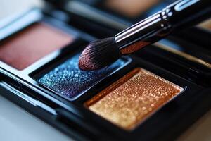 Makeup Brush Applying Glittery Eyeshadow Palette photo