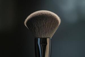 A Close Up View Of A Makeup Powder Brush photo