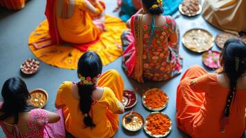 Group of women in vibrant Indian attire gathered for a ceremony. photo