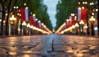 Cobblestone street decorated with French flags at dusk. photo