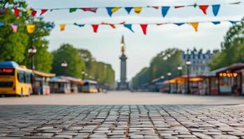 Cobblestone street with festive bunting and blurred background. photo