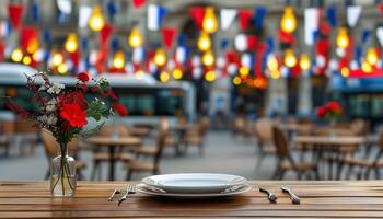 Empty table at outdoor cafe with French flags in background photo