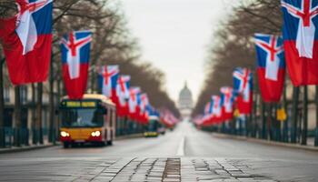 Flags line a city street with a bus and distant building. photo
