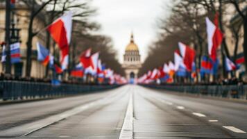 Flags lining a Parisian avenue leading to a grand building. photo